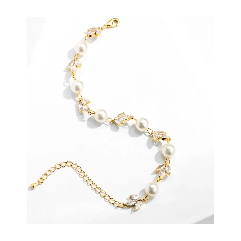 Bracelet de mariée doré à perles et feuilles