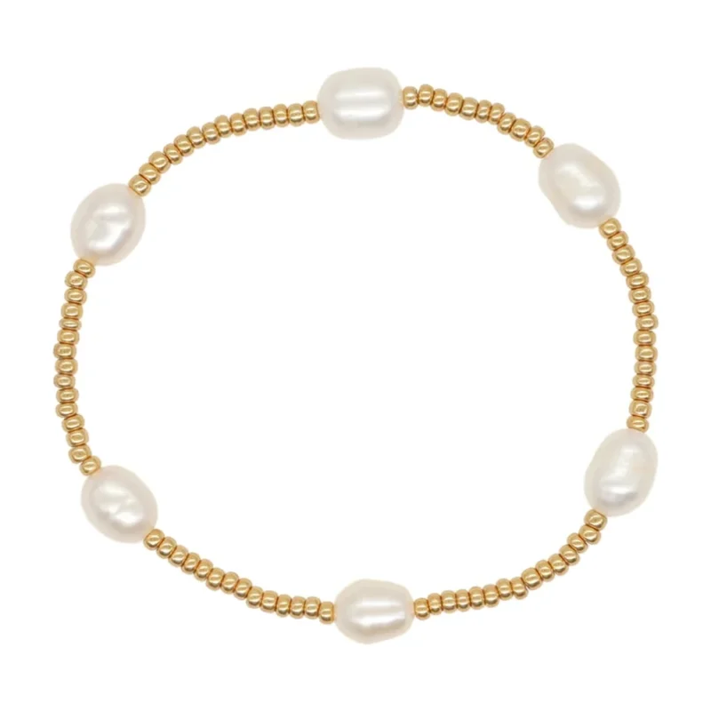 Bracelet élastique en perles dorées et perles d'eau douce